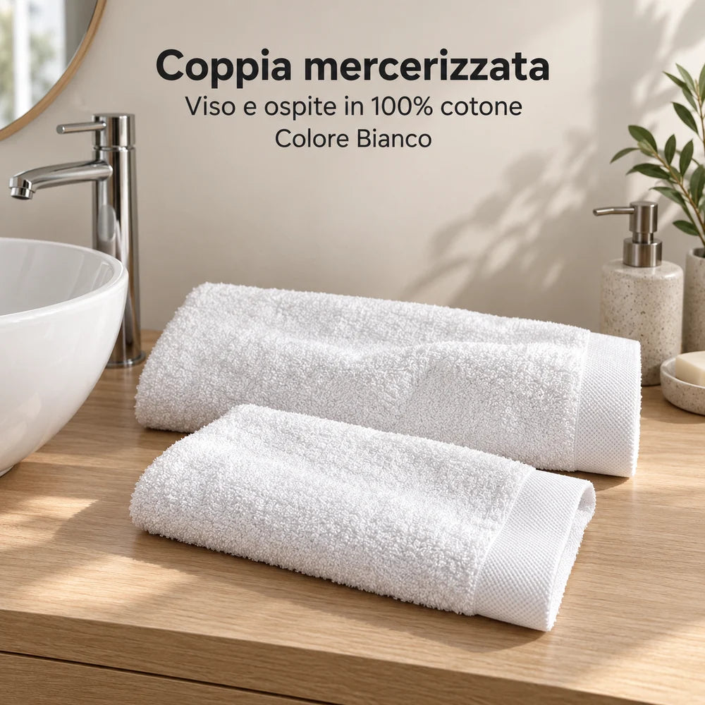 Coppia viso e ospite Bianco ripiegati accanto al lavabo. Foto illustrativa: Bianco. Arredi e accessori esclusi.