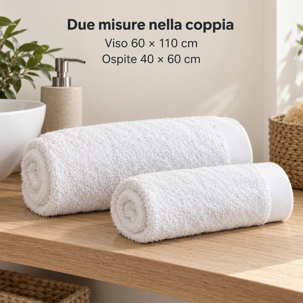Viso e ospite coordinati: due asciugamani Bianco arrotolati separatamente. Foto illustrativa: Bianco. Arredi e accessori esclusi.