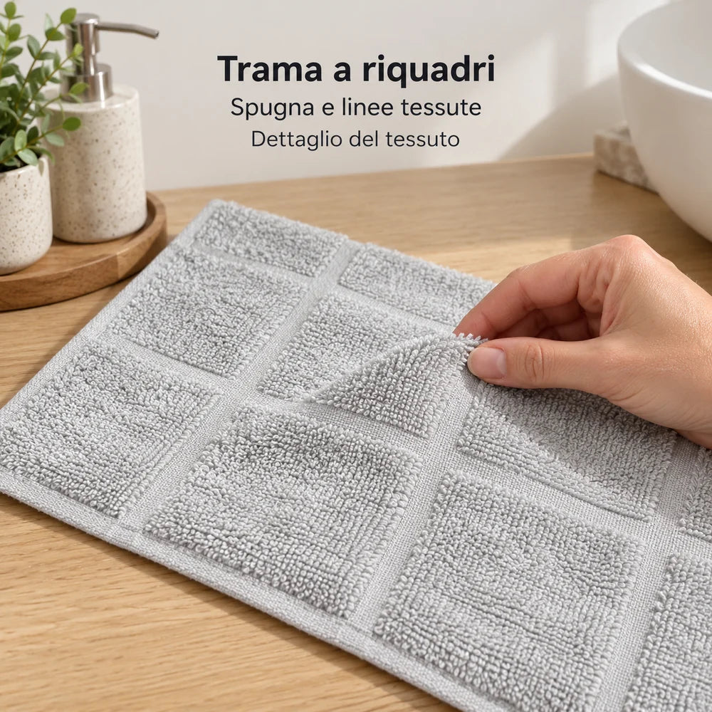 Dettaglio dell’ospite Perla: una mano solleva una piega della spugna a riquadri. Foto illustrativa: Perla. Arredi e accessori esclusi.